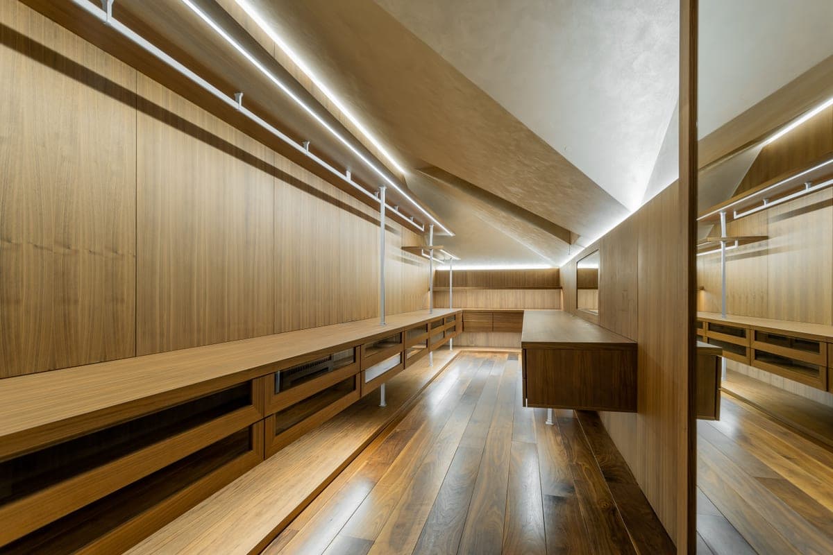 The interior of a closet lit by a warm light