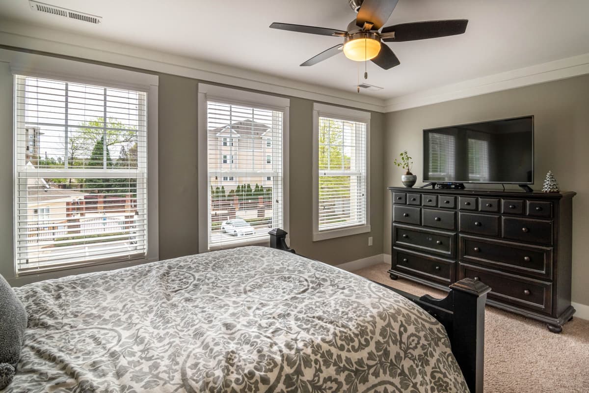 A wooden chest of drawers in a bedroom