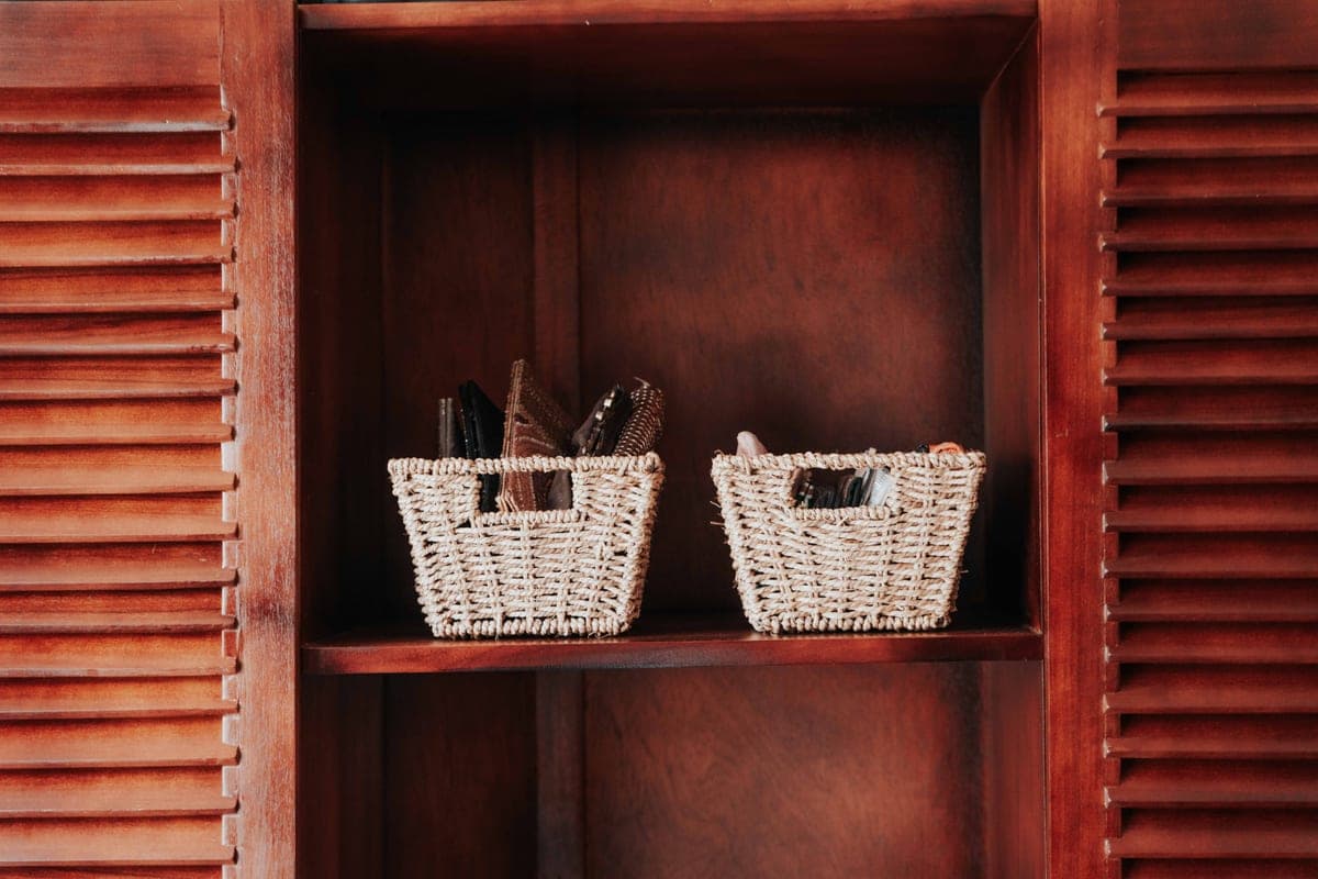 Woven storage baskets on pantry shelves